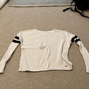 White with blue stripes on arms sweater